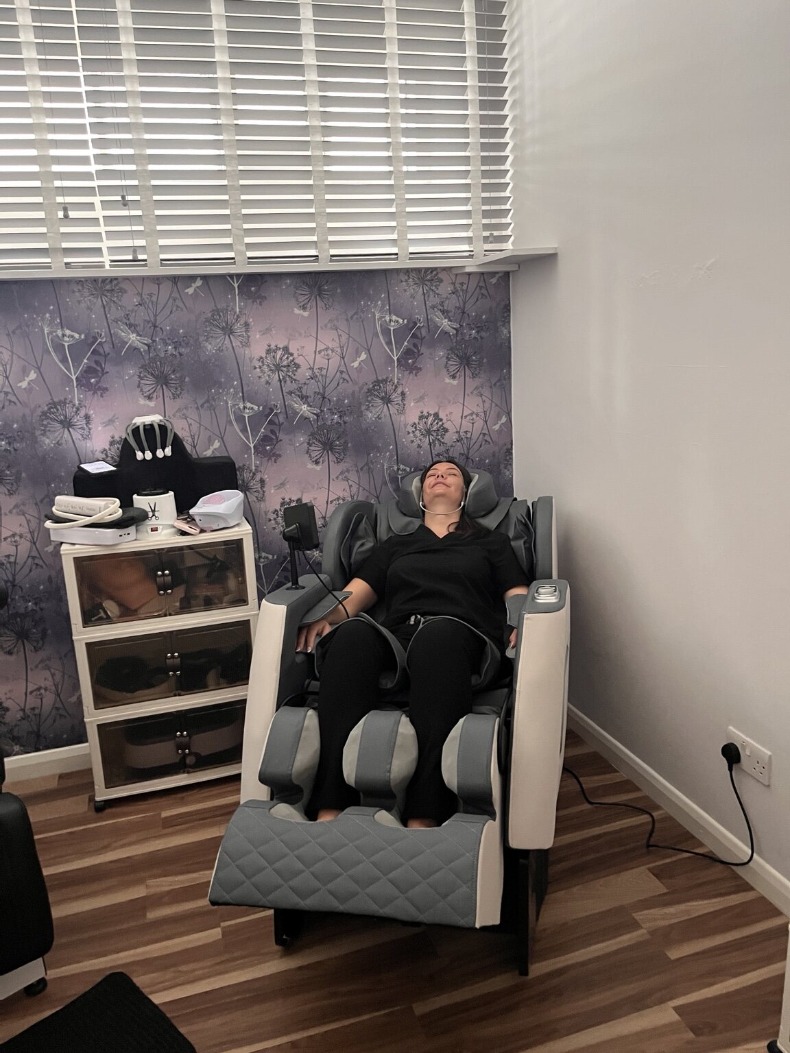 Client relaxing in the Zero Gravity massage chair at Beauty On The Move