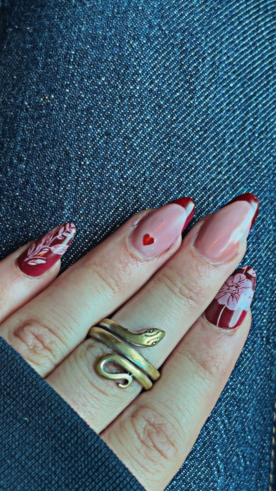 Red French manicure with hearts and hand-painted floral nail art